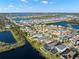 Expansive aerial view of a residential community with multiple homes and scenic water features at 11720 Winterset Cove Dr, Riverview, FL 33579