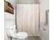 Bathroom featuring a toilet, shower with decorative curtains, and towel rack at 11720 Winterset Cove Dr, Riverview, FL 33579