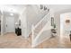 Hallway featuring tile floors, stairs, and white doors at 11720 Winterset Cove Dr, Riverview, FL 33579