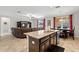 Open concept kitchen featuring granite countertops and dark cabinets in an open-concept living space at 11720 Winterset Cove Dr, Riverview, FL 33579