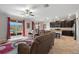 An open-concept living room and kitchen area with stainless steel appliances and granite counters at 11720 Winterset Cove Dr, Riverview, FL 33579