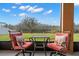 Inviting patio featuring comfortable seating and scenic views of the serene backyard lake at 11720 Winterset Cove Dr, Riverview, FL 33579