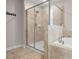 The bright, tiled shower is accompanied by a standalone tub in the background at 11720 Winterset Cove Dr, Riverview, FL 33579