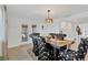 Elegant dining room with dark wood table, ornate chairs, and stylish lighting fixture at 13707 Lagoon Dr, Hudson, FL 34667