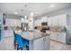 Bright kitchen featuring white cabinets, granite countertops, and a large center island at 1516 Glen Alpine Pl, Valrico, FL 33594