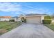 Attractive one-story home with an attached two-car garage and a neatly maintained lawn at 1559 Overland Dr, Spring Hill, FL 34608