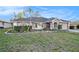 Charming single-story home featuring a well-manicured lawn and inviting curb appeal at 1559 Overland Dr, Spring Hill, FL 34608