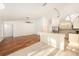 Bright kitchen featuring a breakfast bar, stainless steel appliances, and an open layout to the living room at 1559 Overland Dr, Spring Hill, FL 34608