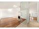 Open-concept living room with hardwood floors, fireplace, and abundant natural light at 1559 Overland Dr, Spring Hill, FL 34608