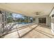 Enclosed pool area with ceiling fan, tile floors, and a sliding door to indoor area at 1559 Overland Dr, Spring Hill, FL 34608