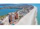 Aerial view showcasing condo towers with beach access, pool, and intercoastal waterway at 17920 Gulf Blvd # 1103, Redington Shores, FL 33708