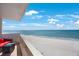 Balcony with seating and ocean view offers stunning views of the beach and beyond at 17920 Gulf Blvd # 1103, Redington Shores, FL 33708