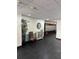 Hallway with a decorative bamboo plant, storage cabinet, and a bank of mailboxes at 17920 Gulf Blvd # 1103, Redington Shores, FL 33708