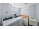 Convenient laundry room with washer, dryer, sink, and storage at 17920 Gulf Blvd # 1103, Redington Shores, FL 33708