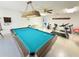 Game room with billiard table and exercise equipment for a fun and active lifestyle at 2230 Sequoia Dr, Clearwater, FL 33763