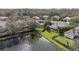 This house is located on a lake with mature tree coverage at 2981 Northfield Dr, Tarpon Springs, FL 34688