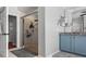 Bathroom featuring a glass enclosed shower with a rainfall shower head, and a granite vanity with double sinks at 2981 Northfield Dr, Tarpon Springs, FL 34688