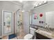 Bathroom featuring glass enclosed shower with access to an outdoor deck, vanity with granite countertop, and plantation shutters at 2981 Northfield Dr, Tarpon Springs, FL 34688