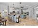 Bright kitchen with white cabinets, double islands, stainless appliances, and tiled floors at 2981 Northfield Dr, Tarpon Springs, FL 34688
