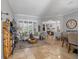 Bright living area featuring neutral walls, travertine flooring, and an open floor plan at 2981 Northfield Dr, Tarpon Springs, FL 34688