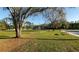 Recreation field with a picnic table on the edge of a basketball court at 2981 Northfield Dr, Tarpon Springs, FL 34688