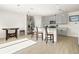 Bright kitchen with stainless appliances, ample cabinetry, and island with seating at 3224 Fresno Pl, Zephyrhills, FL 33541