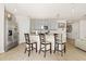 Modern kitchen with stainless steel appliances and breakfast bar seating at 3224 Fresno Pl, Zephyrhills, FL 33541