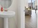 Clean powder room with a pedestal sink at 3224 Fresno Pl, Zephyrhills, FL 33541