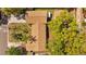 Directly above, a brown roofed house is surrounded by trees, set amongst green grass and other greenery, emphasizing its secluded charm at 3235 34Th N Ave, St Petersburg, FL 33713