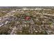 Aerial view featuring a red pin marking the location of a house situated within a neighborhood of tree-lined streets at 3235 34Th N Ave, St Petersburg, FL 33713