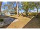 Large backyard with patio and mature trees, perfect for outdoor enjoyment at 3235 34Th N Ave, St Petersburg, FL 33713