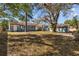 Backyard with ample space, lush greenery, and exterior buildings at 3235 34Th N Ave, St Petersburg, FL 33713