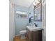 Updated bathroom with a vanity, sink, and tiled shower for a modern look at 3235 34Th N Ave, St Petersburg, FL 33713