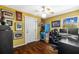 Bedroom with hardwood floors, a ceiling fan, and an arcade game at 3235 34Th N Ave, St Petersburg, FL 33713
