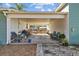 Covered carport with room for seating and decor, leading to fenced in backyard at 3235 34Th N Ave, St Petersburg, FL 33713