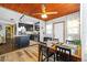 Open-concept dining area and kitchen with wood floors, modern cabinets, and stainless steel appliances at 3235 34Th N Ave, St Petersburg, FL 33713
