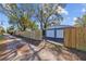 View of a two-car garage with a fenced in yard and driveway at 3235 34Th N Ave, St Petersburg, FL 33713
