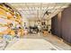 Spacious garage interior with concrete floor, shelving, and open ceiling at 3235 34Th N Ave, St Petersburg, FL 33713