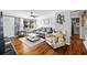 Cozy living room with hardwood floors, ceiling fan, and lots of natural light from a large window at 3235 34Th N Ave, St Petersburg, FL 33713