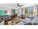 Bright and inviting living room with hardwood floors, comfortable seating, and seamless flow to other rooms at 3235 34Th N Ave, St Petersburg, FL 33713