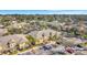 Aerial view showcases yellow townhomes, beautiful landscaping, and a convenient parking lot at 3870 Island Way, St Petersburg, FL 33705