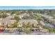 Aerial view of yellow townhomes and buildings with well-maintained landscaping and parking at 3870 Island Way, St Petersburg, FL 33705
