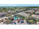 Aerial view of the townhome community with a sparkling pool and lush landscaping at 3870 Island Way, St Petersburg, FL 33705