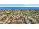 An aerial view showcasing the condo community in a quiet neighborhood with lush greenery and access to area attractions at 3870 Island Way, St Petersburg, FL 33705