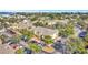 Aerial view of yellow townhomes, lush landscaping, and a parking area at 3870 Island Way, St Petersburg, FL 33705