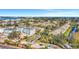 An aerial view of the condo community, with new construction, a well-maintained entrance, and lush landscaping at 3870 Island Way, St Petersburg, FL 33705