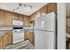 Charming kitchen featuring ample cabinetry, modern appliances, and neutral tones at 3870 Island Way, St Petersburg, FL 33705