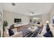 Contemporary living room with white seating, plush rug, and modern decor at 3870 Island Way, St Petersburg, FL 33705