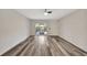 Well-lit room with wood floors and sliding glass doors leading to the exterior at 3870 Island Way, St Petersburg, FL 33705