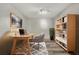 Bright staged office featuring modern decor, a light wood desk, and a cozy rug for comfort at 3870 Island Way, St Petersburg, FL 33705